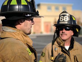 Two firemen in uniform
