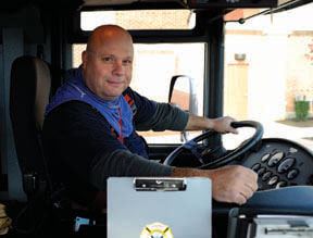 Smiling firetruck driver