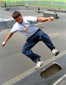 Skateboard on skateboard doing a flip at Black Rock Park